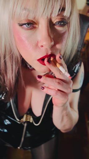 Miss Tina Snua Dressed In PVC &amp; Smoking A Cork Cigarette With Lots Of Dangling, Snap Inhales, OMI &amp; OME   Clip 1