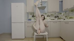 Brunette Cutie Strips Naked And Spreads Wide In The Kitchen