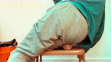 Sitting and Grinding on Baseball in Sweats and Long Sleeve T