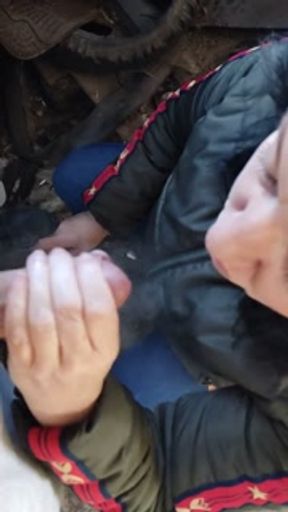 He smokes a cigarette in the garage