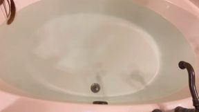 Carissa in the bathtub with the glass dildo--an orgasmic explosion (and a little coughing on water)