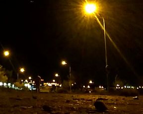 Naked on a quiet street at night