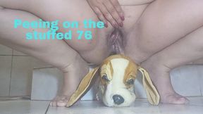 Peeing on the stuffed 76