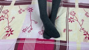 Girl in Gray Long Socks on Her Legs Caresses Herself in Bed