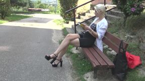 Outdoor dangling of Ambers feet and shoes while she read a book.
