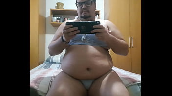 chubby boy plays videogame