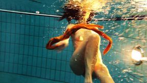 Sexy orange stockings of Markova underwater