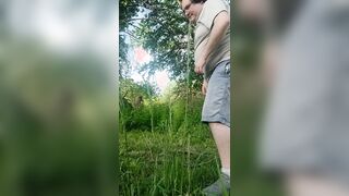 Sean doin yard work n takes a urinate break