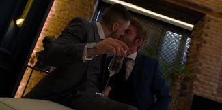 Classy men in suits fuck on the couch until the sperm drops on their shirts