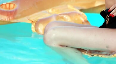 Brunette Milena enjoys a private moment of self-pleasure on an inflatable mat by the pool