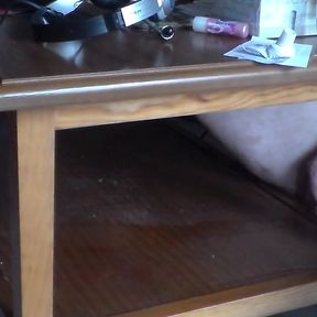 John is pissing on the table shelf