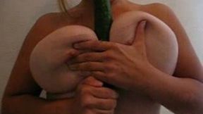 Extra busty MILF wife of mine squeezes cucumber between her melons