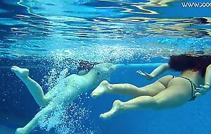 Sexy babes with big tits swim underwater in the pool