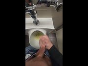 Stroking, pissing, cumming. College uncut guy plays with foreskin in public urinal