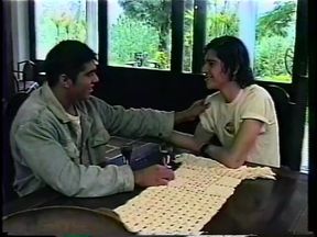 Hot Dude Sits on a Table so His Gay Lover Can Suck His Cock