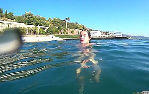 Goldteachers, naked model swims on a public beach in ru