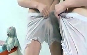 Fragile girl trying on panties in the mirror