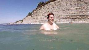 Nude BBW playing in the sea