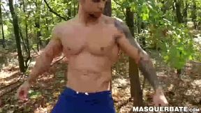 Muscular stud Angelo Godshack wanks off his cock outdoors