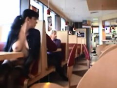 Dark haired girl flashing boobs in public restaurant