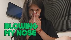 Blowing my nose with my nose red