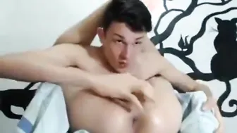 Twink pleasures himself with a lollipop during solo masturbation