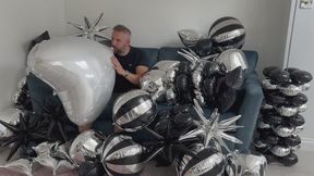 JL blows up a huge heart Mylar balloon