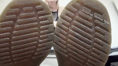 My boots glistening while you pleasure my soles and gagging on my feet