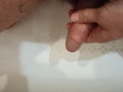 Pissing, spiting on the dickhead and jerk off in the bathroom.