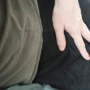 Caressing his cock in black sweatpants