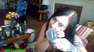 Gothic webcam queen Liz Vicious massages her bare pussy while smoking live