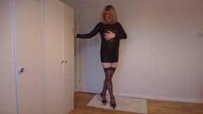 Black leather minidress, stockings and no panties