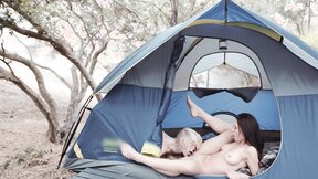 Two passionate lesbians with natural tits make love all over the camping site