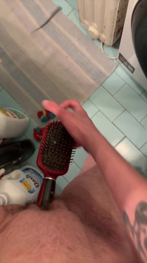Hairy amateur babe plays with hairbrush and inserts object into her wet pussy