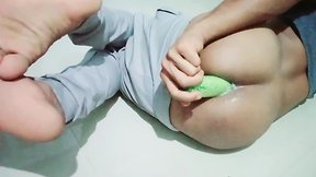 Indian femboy inserting large vegetable dildo into hole