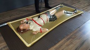 Disciplined punishment and spanking of a naughty adult student in a latex vacuum bed
