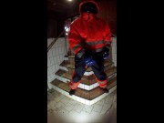 Rufus pawing off in Raingear