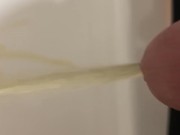 Daddy draining his cock of piss