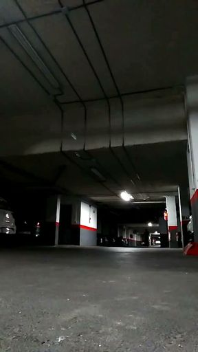 Naked in an underground parking lot