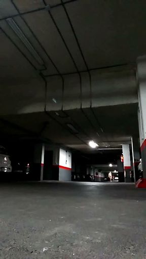 Naked in an underground parking lot