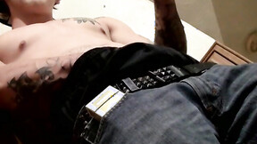 Inked Kyd Cash chainsmoking while working his meat in his boxer shorts