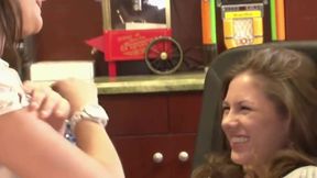 Sexy brunette sits on a chair so her girlfriend can lick her fuckhole