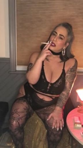 Smoking Fetish Mistress Kandi smoking with dangles ( no nudity)