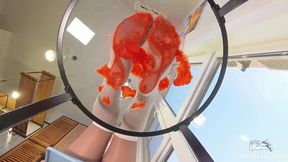 My Nylon Feet Squeezing Strawberry Juice on a Glass Table