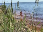 Sexy nudist girl on a wild beach
