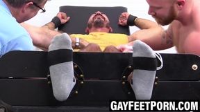Inked stud indulges in his buddyâs toes intimately