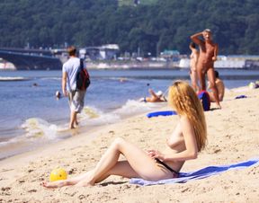 Nude beach girl is having a great time