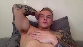 Tatoo Hunk Stroking Cock on Bed