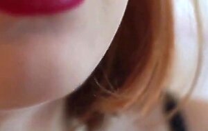 Redhead babe smokes and gives a blowjob to a big cock