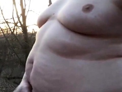 Chubby masturbates in the woods